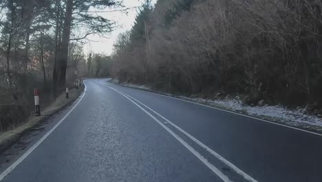 POV-shot-driving-through-snowy-roads-heading-towards-the-Isle-of-Skye