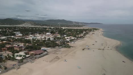 Aerial-of-Los-Barriles-town-in-La-Paz-Municipality,-Baja-California-Sur,-Mexico-desert-and-beach