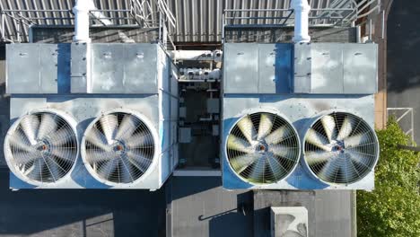 Top-down-aerial-of-spinning-ventilation-AC-units-on-rooftop