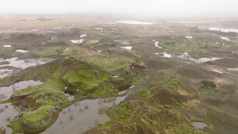 Aerial-panoramic-view-of-Raudholar-craters,-the-Red-Hills,-geological-formations-of-volcanic-terrain,-Iceland