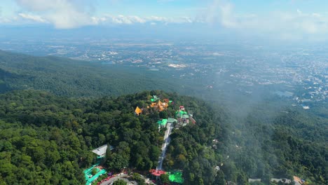 Wat-Phra-That-Doi-Suthep-Temple-View-from-the-Clouds-and-Chiang-Mai-City-Background,-Buddhist-Temple-overlooking-the-City