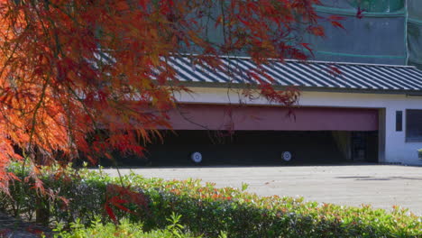 Japanese-kyudo-archery-targets-at-dojo-in-autumn-with-Japanese-maple-in-foreground