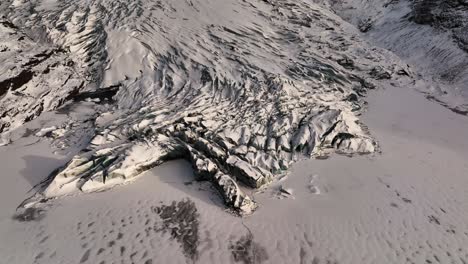 Aerial-view-of-Sólheimajökull-glacier-ice-melting,-climate-change,-Iceland-at-dusk