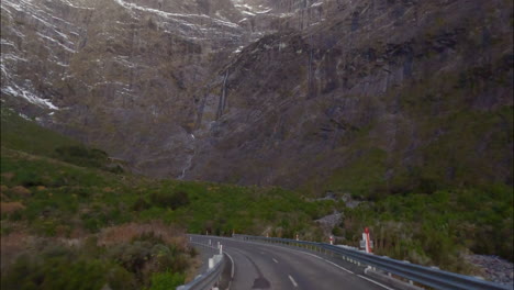 Driving-On-State-Highway-94-Near-Homer-Tunnel-Towards-Milford-Sound-Fiordland-National-Park-In-South-Island,-New-Zealand