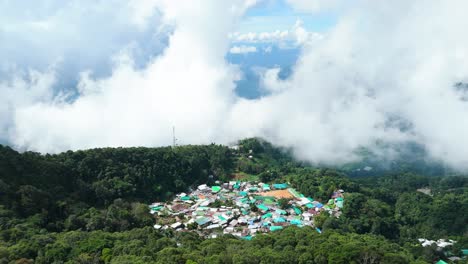 A-Village-nestled-in-the-Clouds-surrounded-by-Evergreen-Forest,-Remote-Secluded-High-Altitude-Mountain-Hill-Tribe-Village-in-Northern-Thailand,-Doi-Pui-Village-Doi-Suthep-National-Park