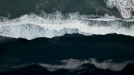 Bird's-Eye-View-Of-Waves-Crashing-At-Reynisfjara-Black-Sand-Beach-In-Iceland---Drone-Shot