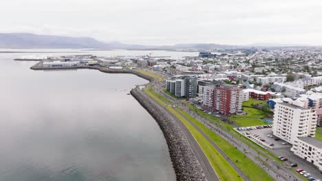 Reykjavik-aerial-view-during-yearly-Marathon-along-coastline,-Iceland