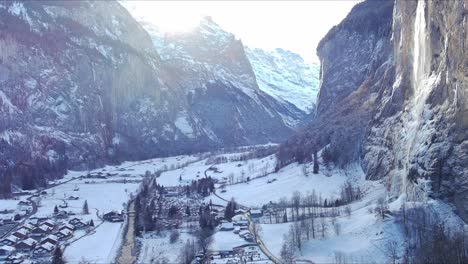 Slowly-Moving-Towards-Snowy-Valley-|-Lauterbrunnen-Switzerland,-Swiss-Valley-in-Alps-Drone,-Europe,-4K