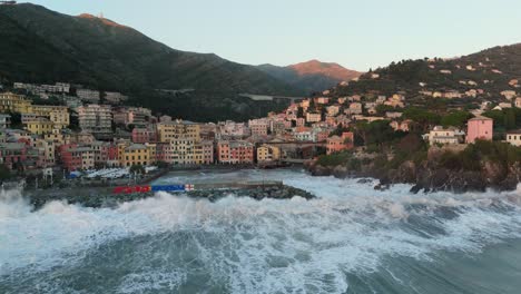 Massive-sea-wave-crashing-on-stony-harbor-pier-with-splash,-Genoa-city