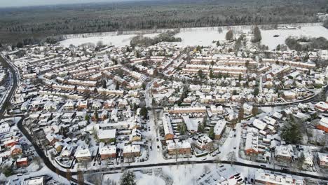 Amazing-aerial-of-a-snow-covered-town-on-sunny-winter-day