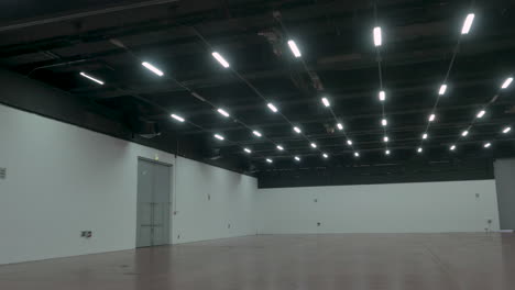 Dolly-movement-moving-away-from-large-empty-space-very-well-lit