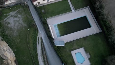 Desolate-Aerial-View-of-Abandoned-Pool