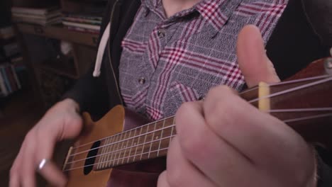 Ukulele-Being-Played-By-Person