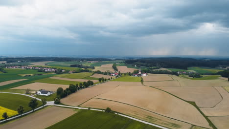 Bavarian-village-landscape-as-the-drone-hovers,-turning-from-left-to-right