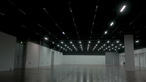 Cinematic-gimble-shot-of-empty-hall-with-lights-turning-on