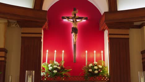 Pan-shot-of-a-crucifix-inside-a-catholic-church