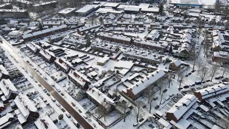 Aerial-of-beautiful-small-town-covered-in-snow
