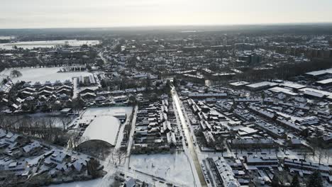 Aerial-of-a-beautiful-snow-covered-town-on-a-overcast-day