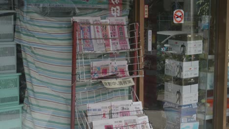 Handheld-Shot-of-a-Newspaper-Rack-in-Taiwan