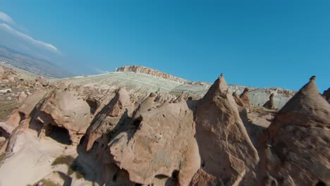 FPV-Drone---Distinctive-Fairy-Chimneys-In-Cappadocia-Semi-arid-Region-In-Central-Turkey
