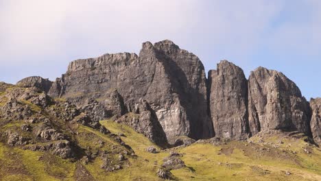 looking-up-at-the-black-cliff-faces-of-the-old-man-of-storr-hike-on-Isle-of-Skye,-hIghlands-of-Scotland