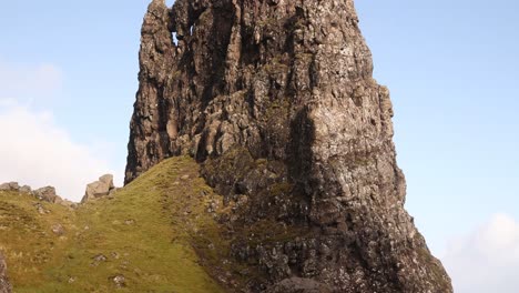 looking-up-at-giant-natural-rock-pillars-of-old-man-of-storr-on-Isle-of-Skye,-hIghlands-of-Scotland