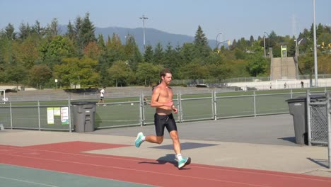 Fitness-Man-With-Muscular-Body-Running-At-The-Outdoor-Sports-Stadium