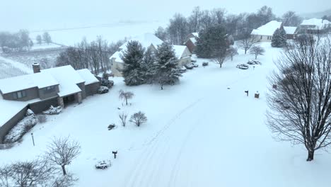Aerial-flyover-of-snowy-neighborhood