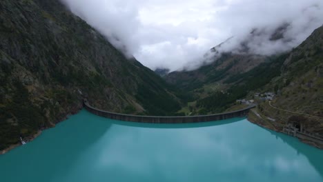 Drone-shot-flying-over-the-Place-de-Moulin-reservoir-and-dam-in-the-Aosta-province-in-Italy