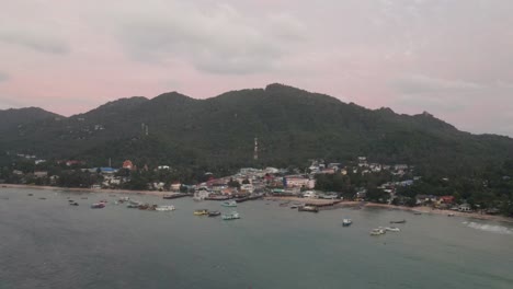 Aerial-View-Over-Koh-Tao-Pier-And-Island-With-Boats-Moored-In-Ocean