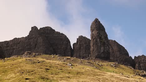 looking-up-at-giant-rock-pillars-of-old-man-of-storr-on-Isle-of-Skye,-hIghlands-of-Scotland