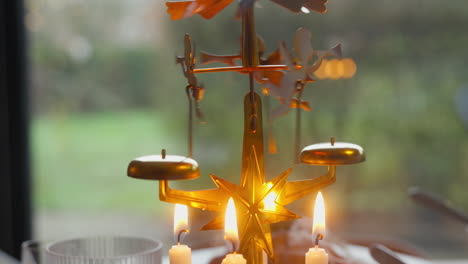 Traditional-Christmas-carousel-with-glowing-candles-and-spinning-angels