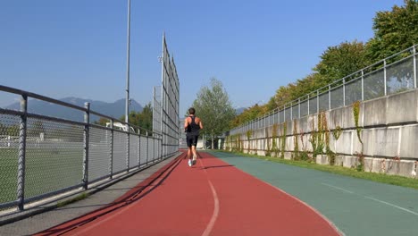 Sportsman-Running-On-A-Sports-Track-During-Sunny-Day