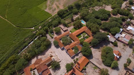Drone-shot-flying-over-the-Hacienda-de-Molinos-in-Salta,-Argentina-while-panning-up