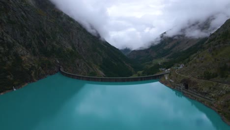 Drone-shot-flying-sideways-over-the-Place-Moulin-dam-in-the-province-of-Aosta-in-Italy