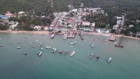 Aerial-High-Angle-View-Over-Koh-Tao-Pier-With-Boats-Moored-In-Ocean