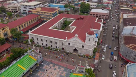 Aerial-drone-shot-of-Santo-Nino-Basilica,-the-oldest-Church-in-Cebu-City---Philippines