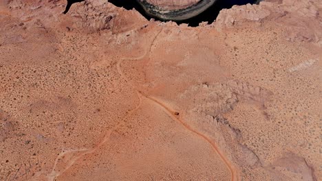 A-high-flying-drone-shot-over-Horseshoe-Bend,-the-“east-rim-of-the-Grand-Canyon”,-located-near-the-town-of-Page,-Arizona