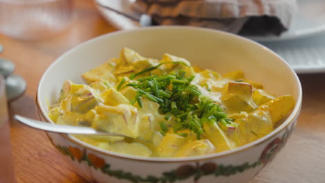 Creamy-curry-salad-garnished-with-chives-in-a-bowl-at-Scandinavian-julefrokost
