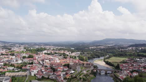 Panoramic-view-of-Barcelos-and-Cávado-River,-Portugal---aerial