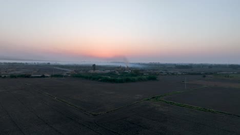 Rustic-dawn-over-a-Sindh-village,-Pakistan---aerial