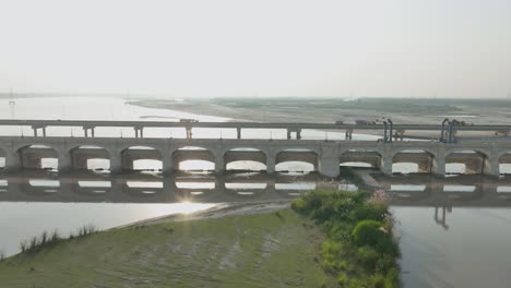 Reflective-Sukkur-Barrage-on-the-Indus,-Sindh,-Pakistan