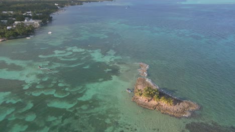 Aerial-Circle-Shot-of-Small-Island-in-the-Caribbean-Sea