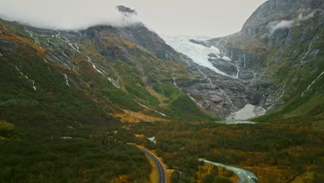 Norwegian-Road-with-a-glace-and-mountains