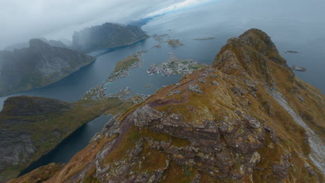 FPV-Drone-Aerial-Reveal-of-Reine,-Lofoten-Islands-in-Norway,-impressive-low-flight