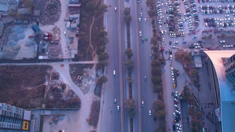 Aerial-shot-of-road-traffic-and-parking-lot-at-the-downtime---From-the-top-shot