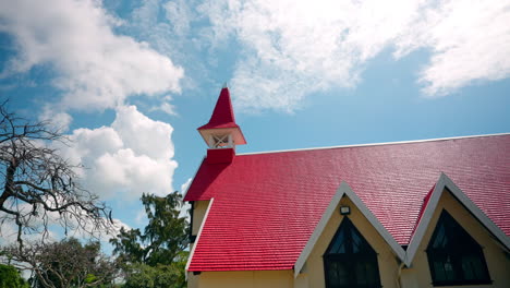 Panoramic-shot-of-small-wooden-church-with-red-rooftop