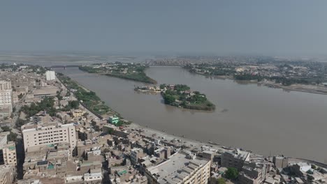 Sukkur-city-skyline-and-Indus-River,-Sindh,-Pakistan---aerial
