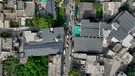 Solar-rooftops-over-Gujranwala-street,-Punjab,-Pakistan
