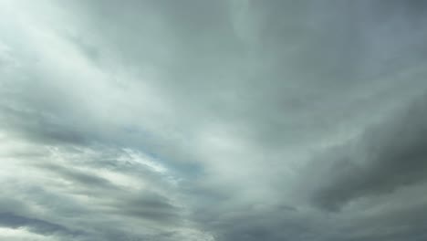 Timelapse-of-the-sky-with-only-a-patch-of-blue-and-white-clouts-transitioning-to-a-fully-overcast-sky-with-stormy-clouds